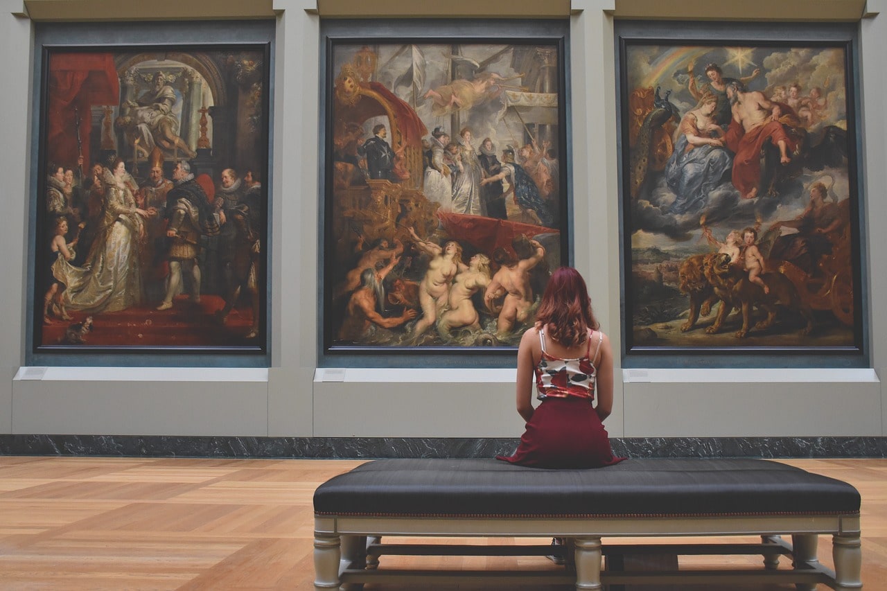 Woman looks at the huge work of art
