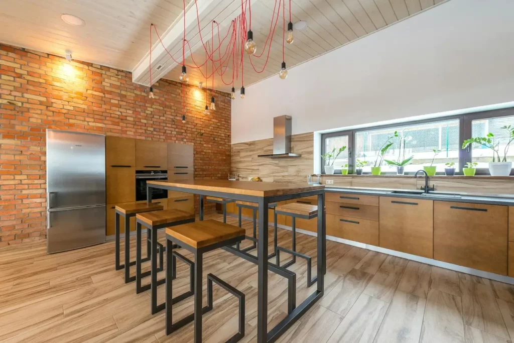 An kitchen with wood and metal bar chairs