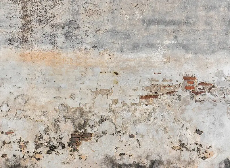 A wallpaper design like an old wall with faded colors of beige, brown and gray