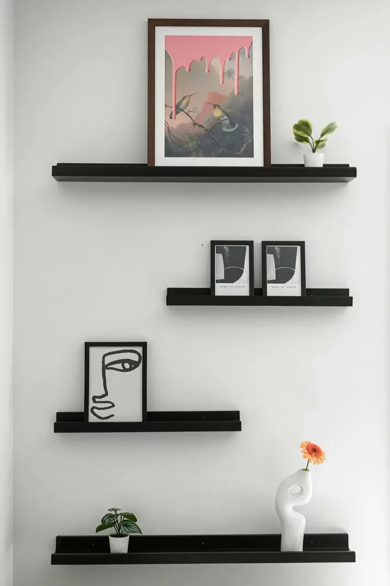 floating-shelf-display-of-framed-pictures-on-the-wall-as-a-creative-ideas-for-hanging-pictures