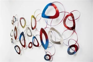Wall installation of varied metallic and colored abstract loops.