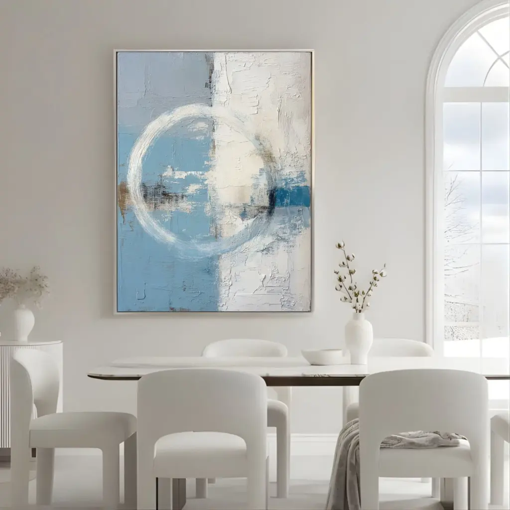 Abstract blue and white circular painting above dining table