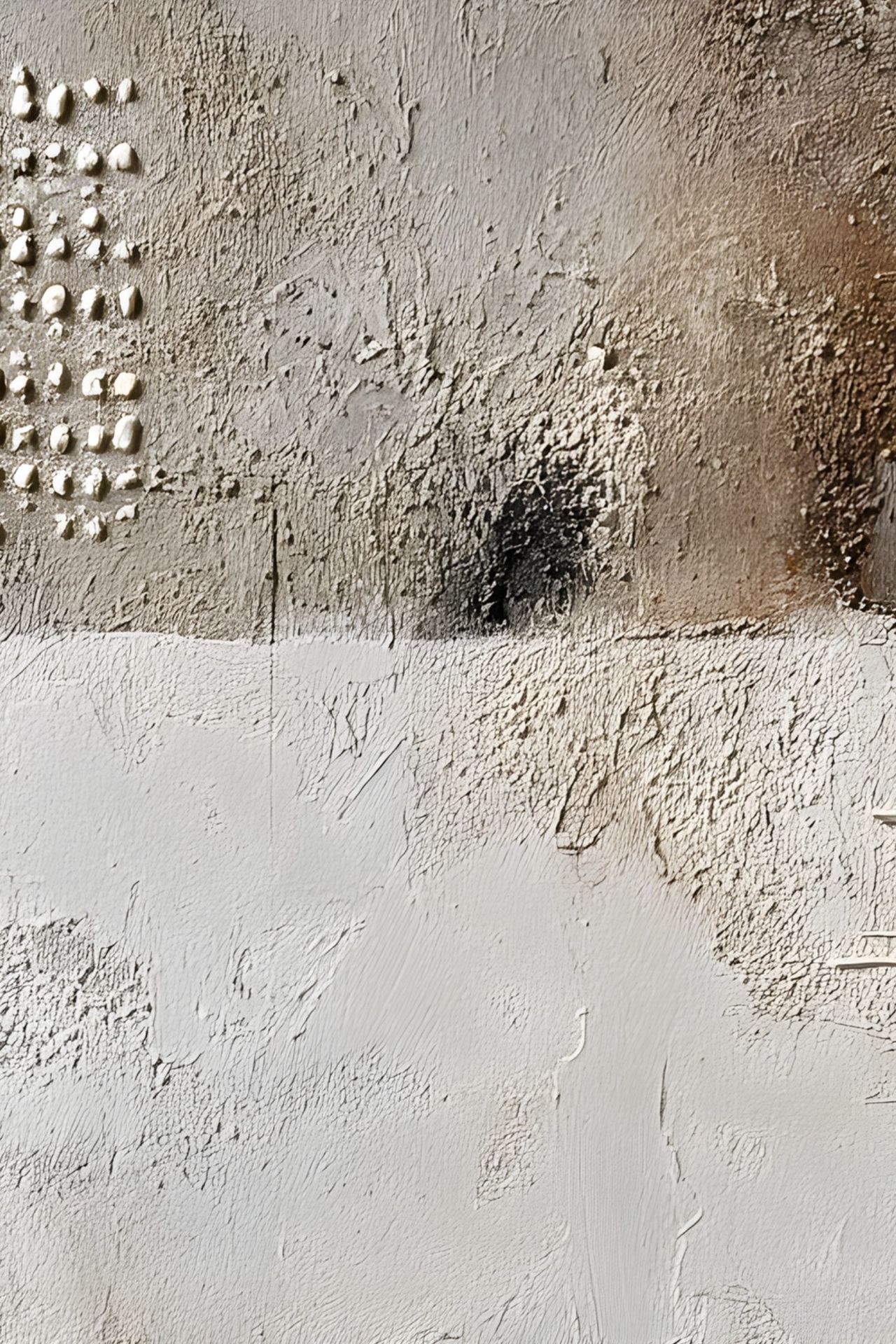 Close-up of textured abstract artwork with neutral tones and dark accents.
